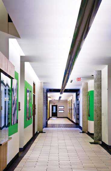 A good example of colour contrast and width in a hallway. The central overhead lighting is also useful for wayfinding.